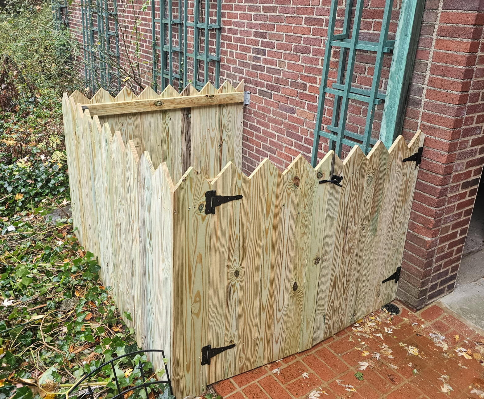 Fenced in area for trash cans